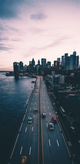 [2436x1125]公路 沿海 城市 傍晚 苹果手机壁纸图片