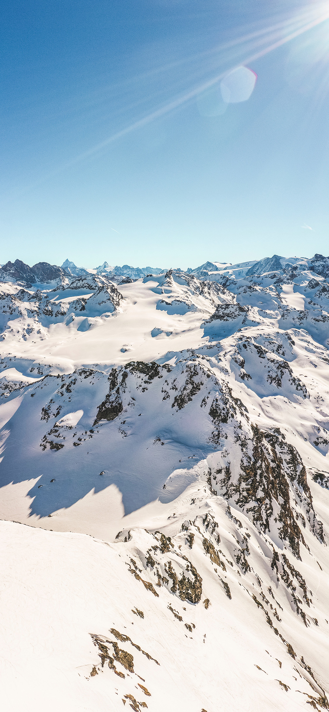 [2436×1125]冬季 雪山 雪景 阳光 苹果手机壁纸图片
