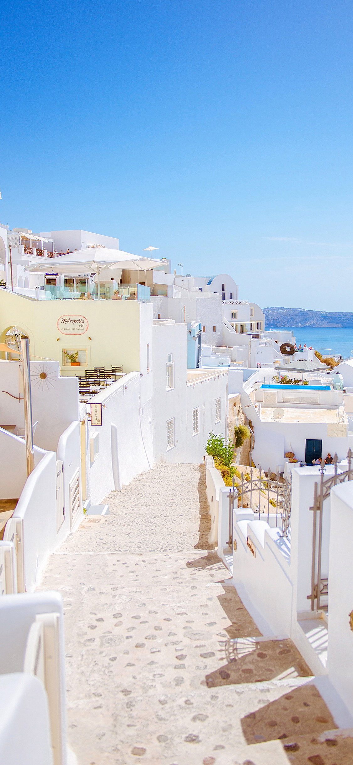 [2436×1125]圣托里尼岛 爱情海 希腊 道路 浪漫 房屋 苹果手机壁纸图片
