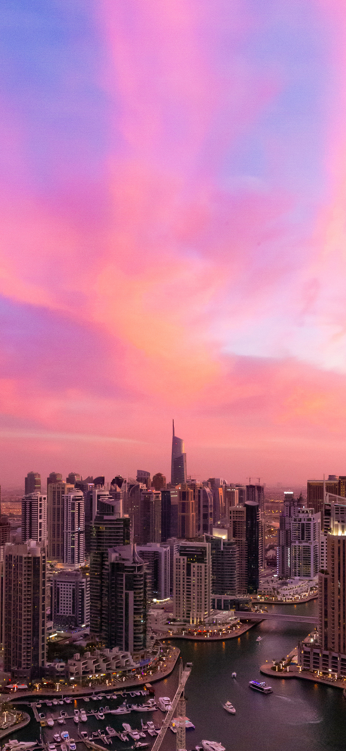 [2436×1125]城市 夕阳 彩霞 高楼林立 苹果手机壁纸图片