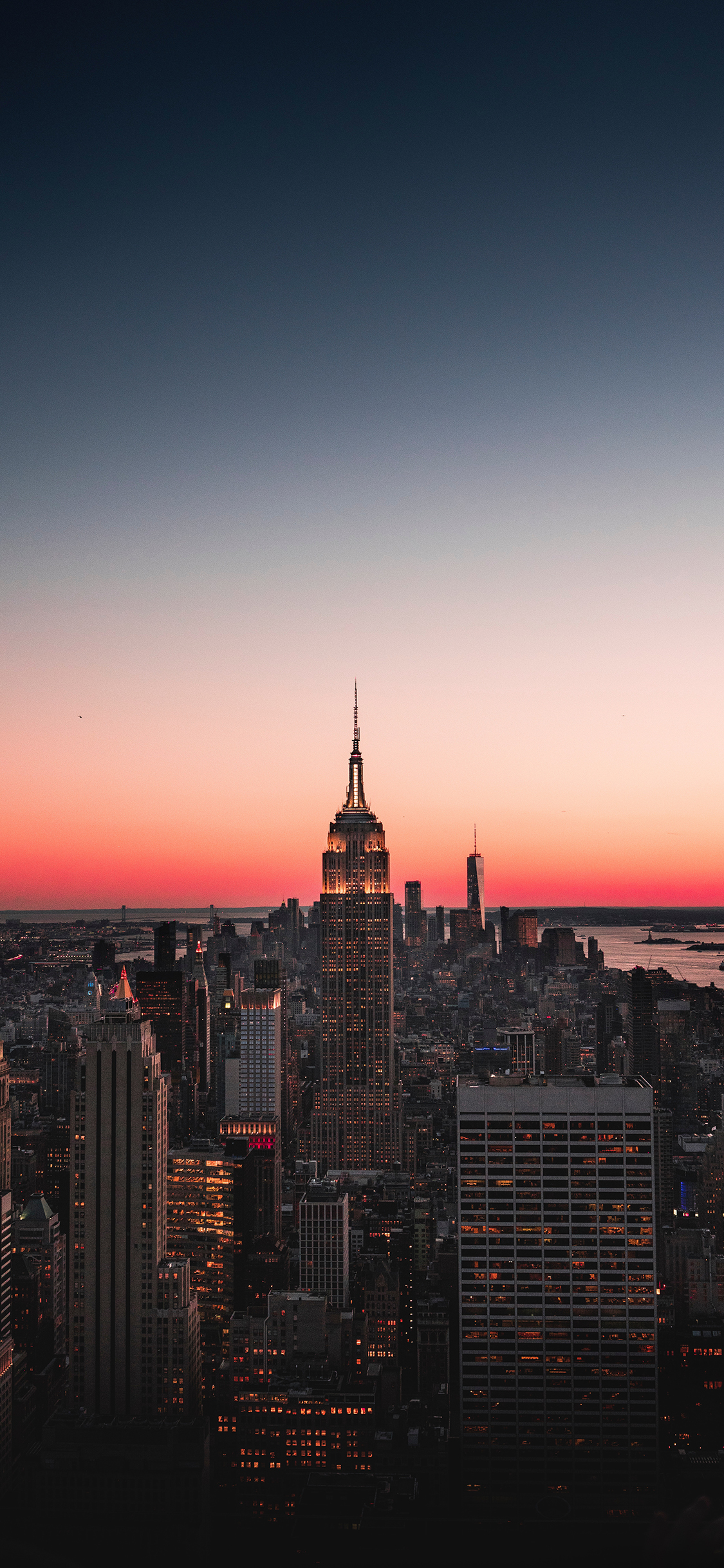 [2436×1125]城市 建筑 高楼大厦 晚霞 苹果手机壁纸图片