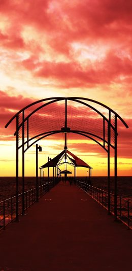 [2436x1125]夕阳 火烧云 海边 长桥 苹果手机壁纸图片