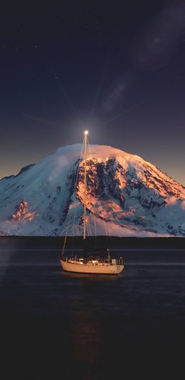 [2436x1125]夜晚 轮船 海面 雪山 苹果手机壁纸图片