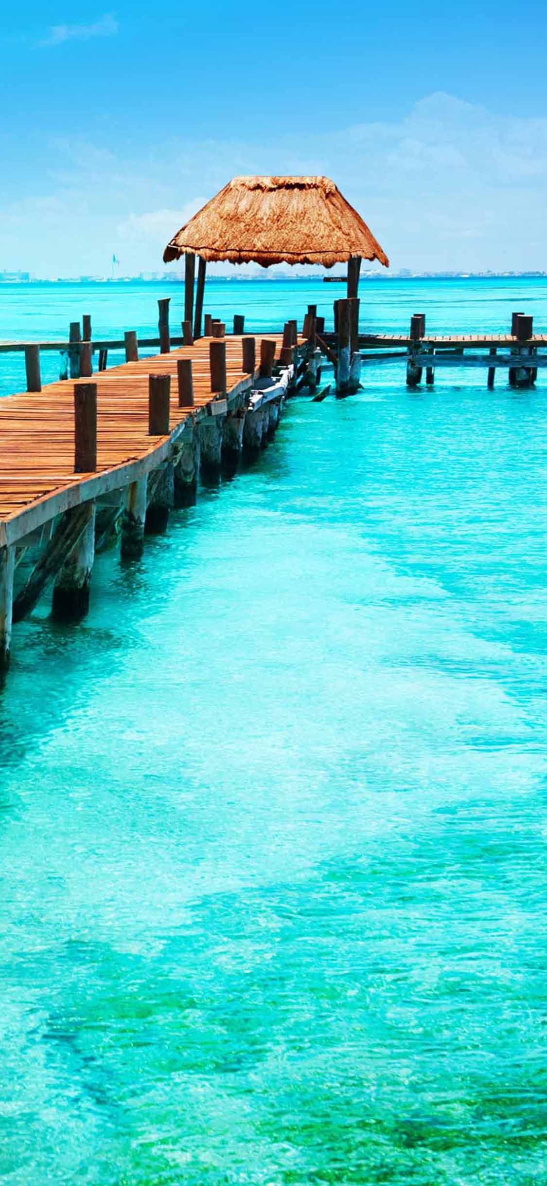 [2436×1125]大海  木桥 草亭子 休闲 苹果手机壁纸图片