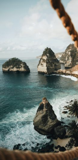 [2436x1125]大海 岩石 绳索 海景 苹果手机壁纸图片