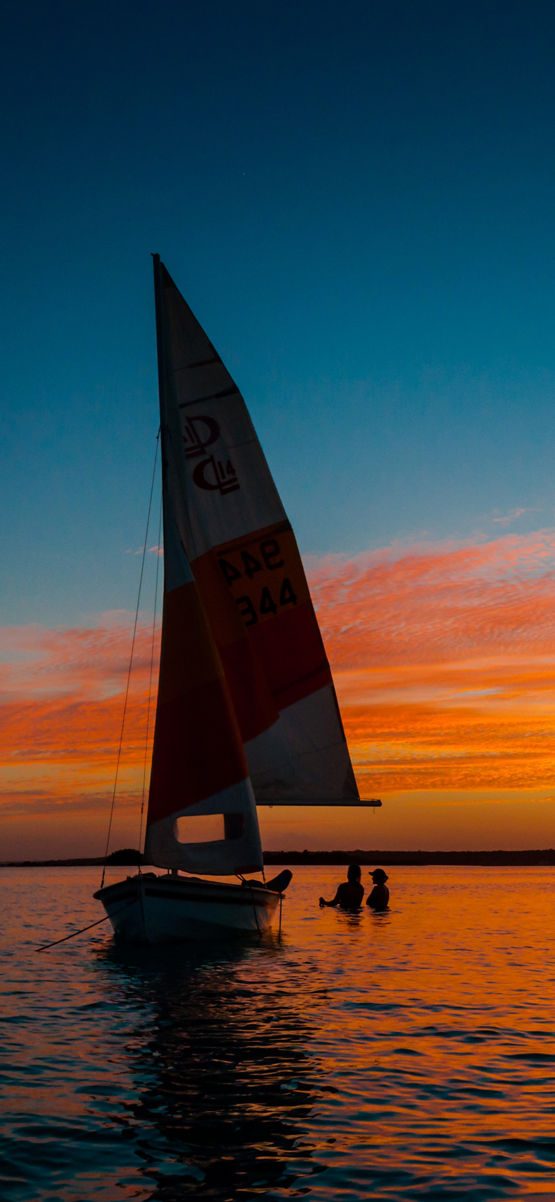 [2436×1125]大海 帆船 夕阳美景 苹果手机壁纸图片