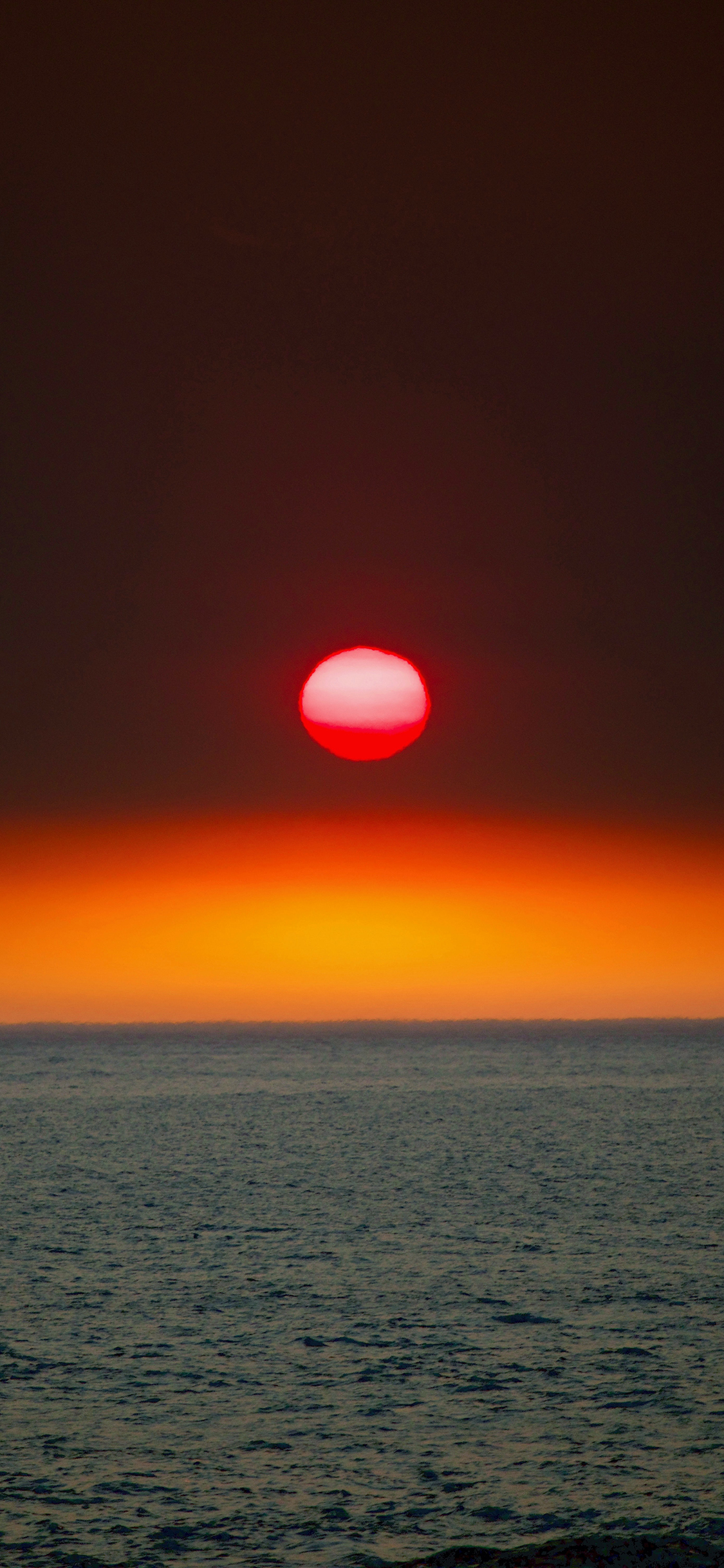 [2436×1125]大海 日出 太阳 红霞 苹果手机壁纸图片