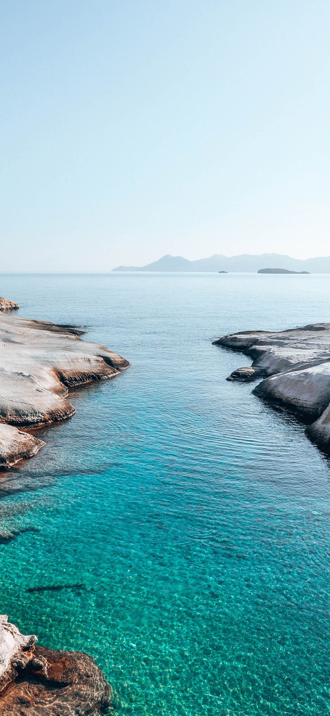 [2436×1125]大海 湛蓝 海景 岩石 苹果手机壁纸图片