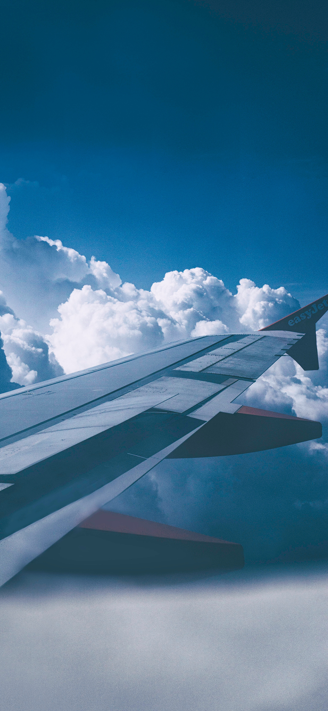 [2436×1125]天空 云层 飞机 机翼 飞行 苹果手机壁纸图片