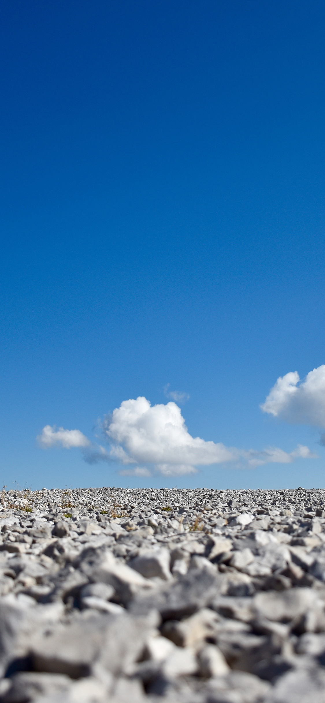 [2436×1125]天空 蓝天白云 石头 苹果手机壁纸图片