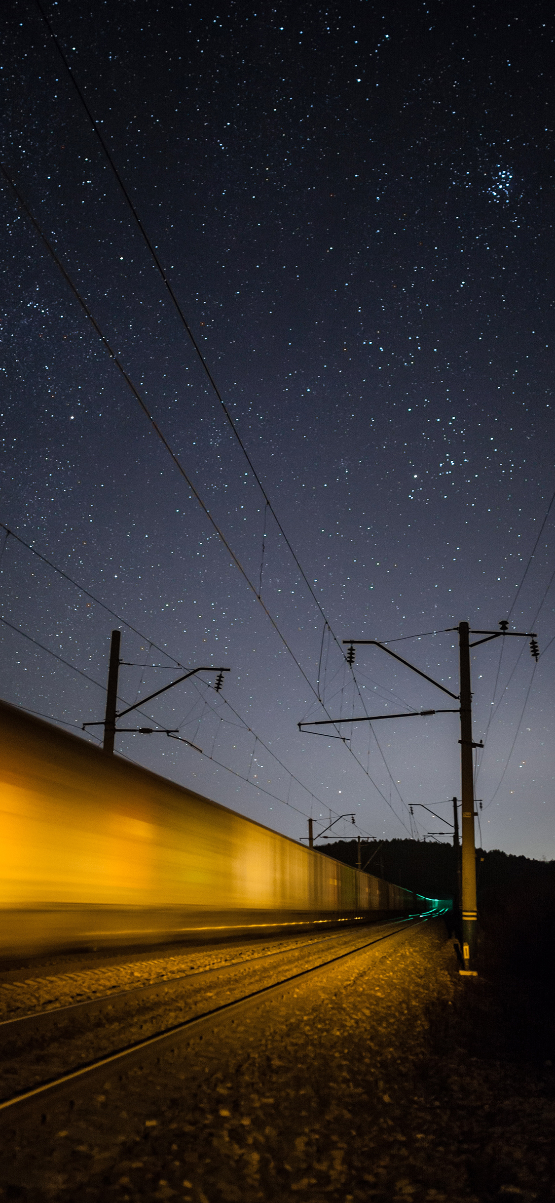 [2436×1125]星空夜景 火车道 行驶 速度 苹果手机壁纸图片