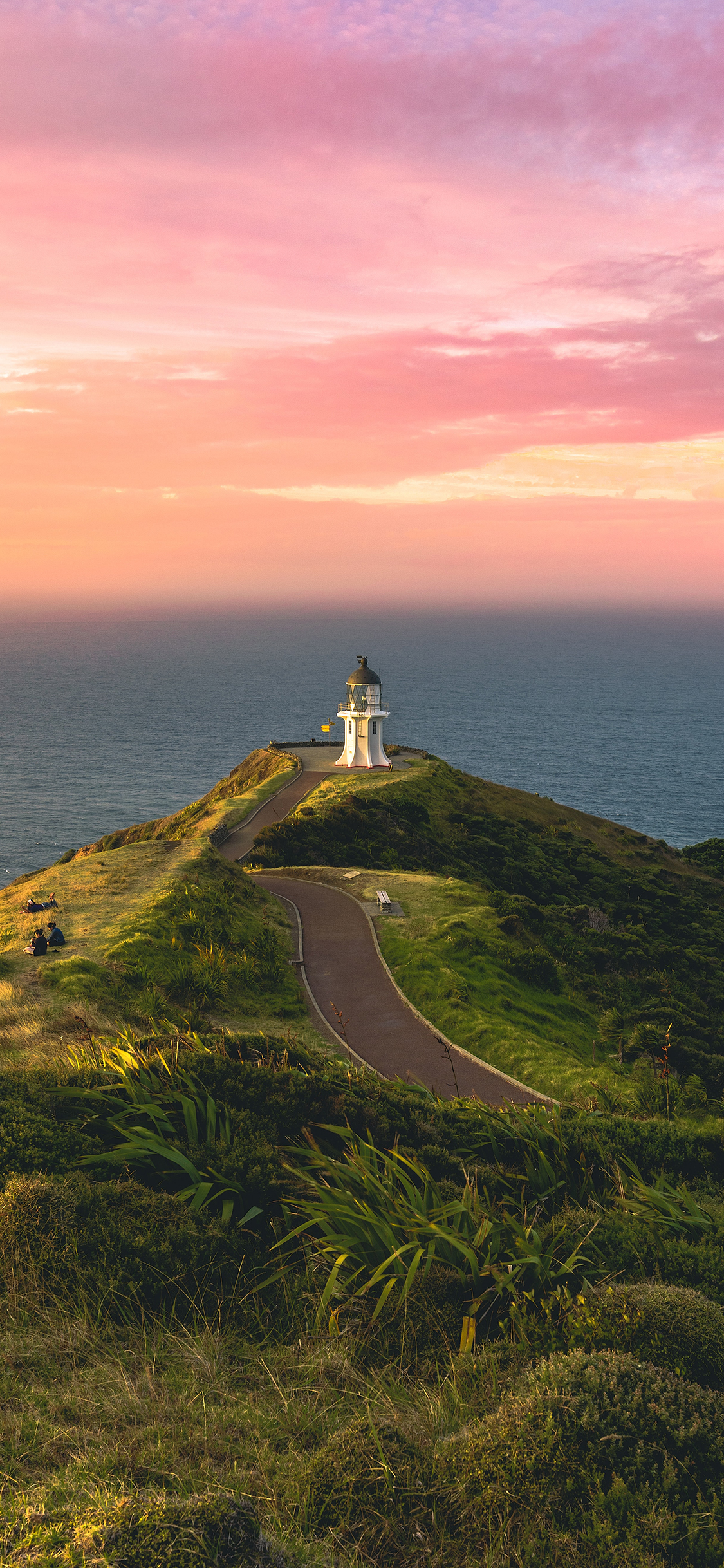 [2436×1125]景色 海岸 灯塔 夕阳 绿植 苹果手机壁纸图片