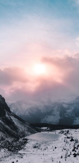 [2436x1125]景色 阳光 云雾 雪季 山脚 苹果手机壁纸图片