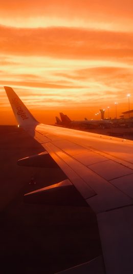 [2436x1125]机翼 黄昏 日落 飞机 夕阳 苹果手机壁纸图片
