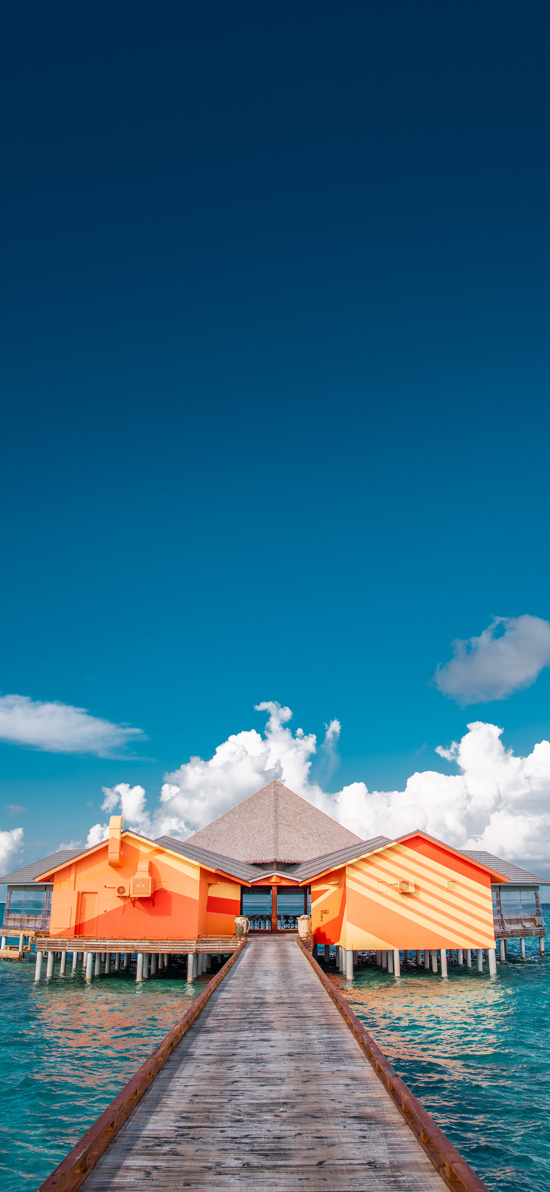 [2436×1125]海岸 度假 海上别墅 大海 蓝天 苹果手机壁纸图片