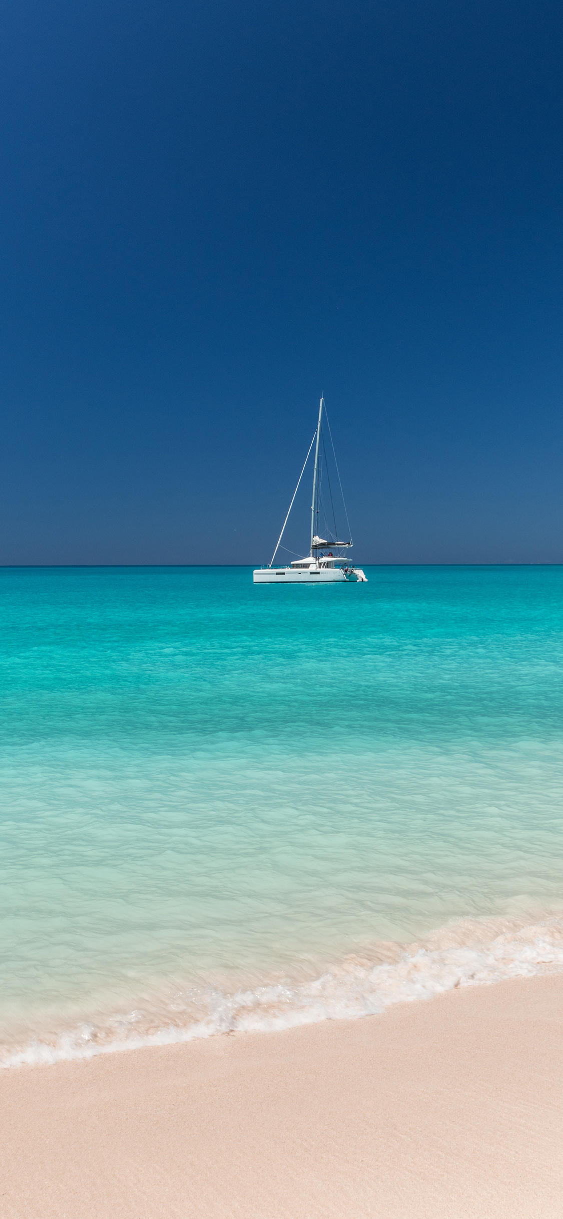 [2436×1125]海平面 海边 沙滩 轮船 苹果手机壁纸图片