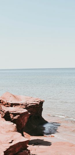 [2436x1125]海边 礁石 大海侵蚀 海浪 苹果手机壁纸图片