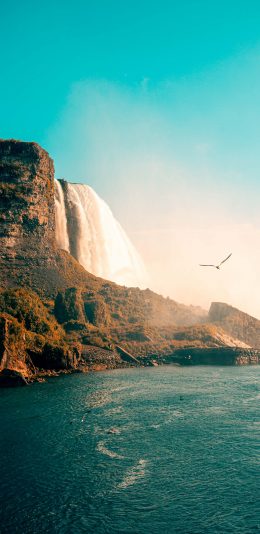 [2436x1125]瀑布 大海 蓝天 峭壁 苹果手机壁纸图片