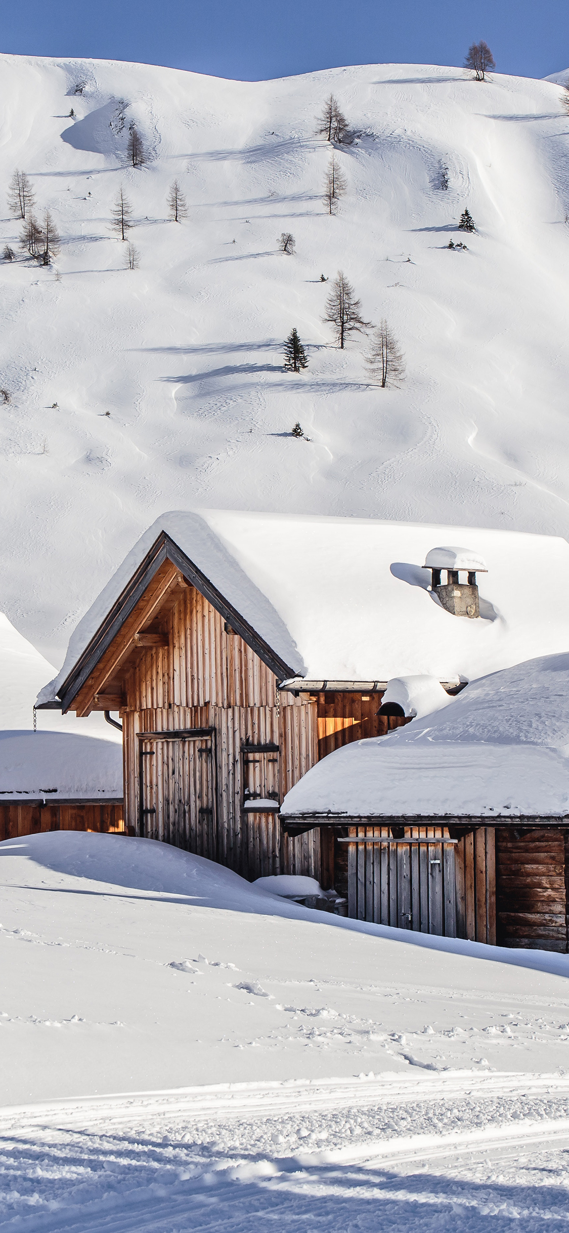 [2436×1125]雪地 白雪覆盖 木屋 意境 苹果手机壁纸图片