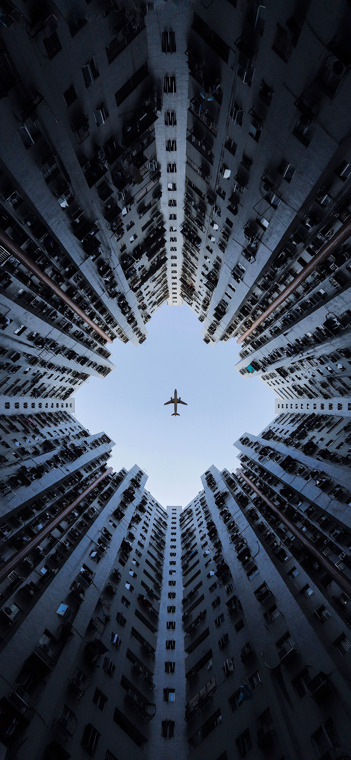 [2436×1125]飞机 建筑 城市 飞行 苹果手机壁纸图片