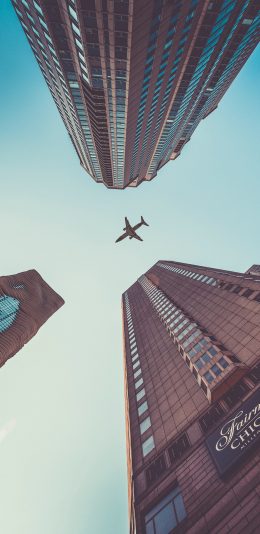 [2436x1125]飞机 建筑 城市 飞行 航空 客机 苹果手机壁纸图片